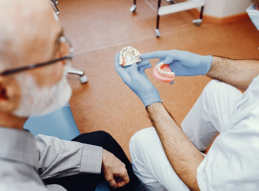 Old man sitting in the dentist's office